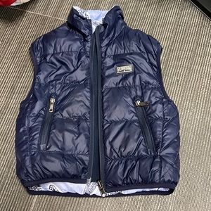 Double sided vilebrequin vest with feathers inside